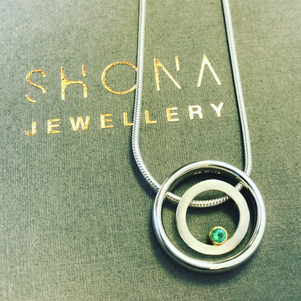 Emerald Halo Necklace On Packaging